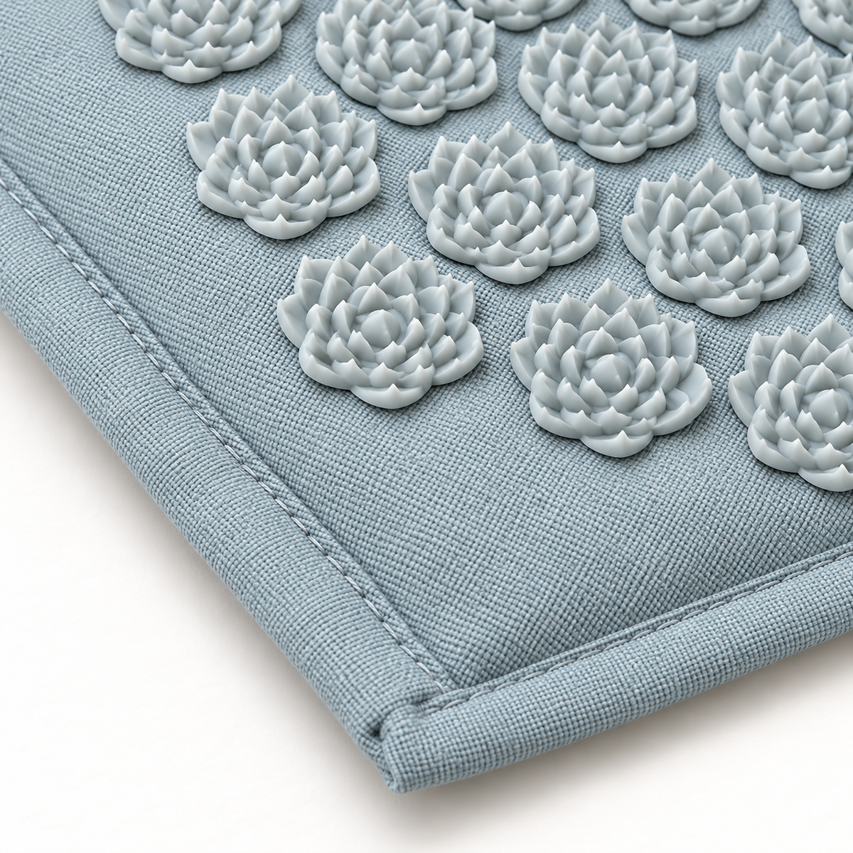Blue fabric, edge stitching and white lotus pressure points