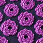 Purple layered lotus pressure point detail on dark fabric
